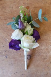White rose with purple buttonhole