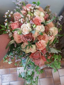 Mixed pink, peach and blush rose bridal bouquet