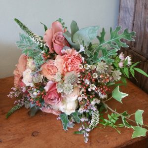 Mixed pink, peach and blush rose bridesmaid bouquet