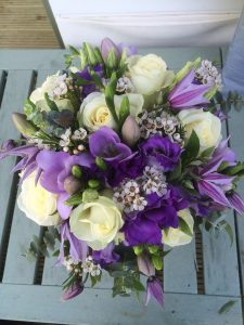 White and purple mixed flower bridesmaid bouquet