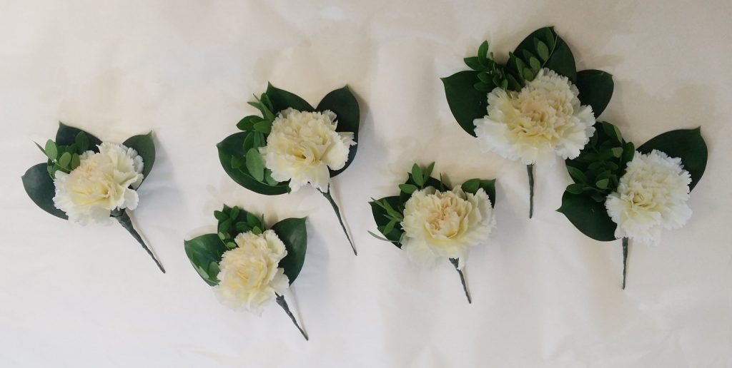 White carnation buttonholes