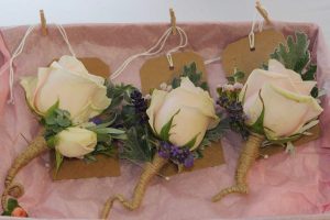 Blush rose with purple buttonholes