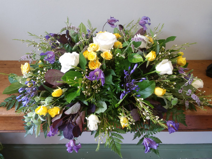Spring double ended spray - white roses, purple agapanthus, clematis and yellow spray roses