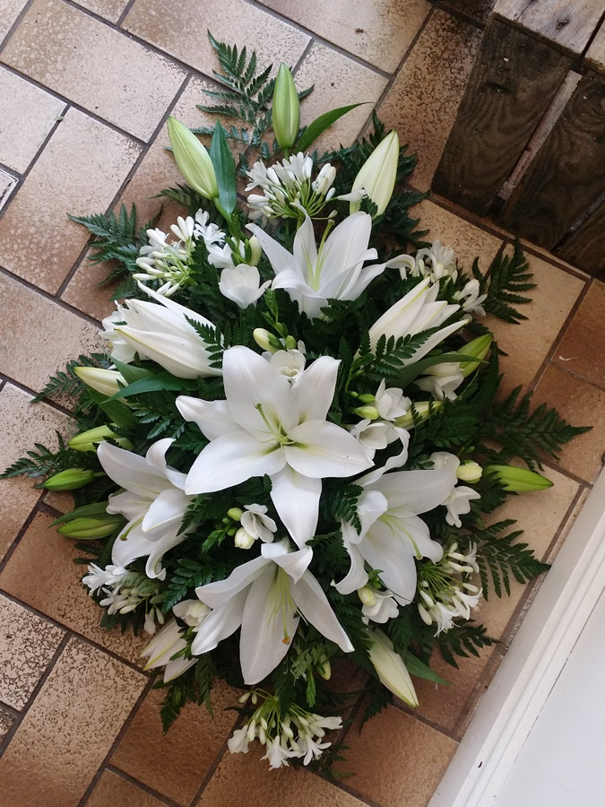 White lily, agapanthus and freesia single ended spray