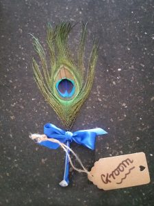 Peacock feather groom buttonhole