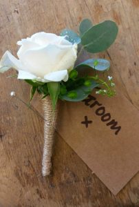 White rose groom buttonhole