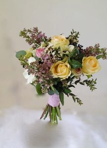 Yellow, white and pink handtied bridesmaid bouquet