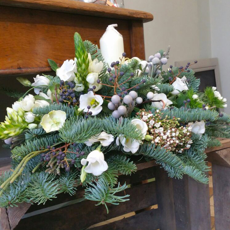 Large christmas candle table arrangement with lisianthus and helibores