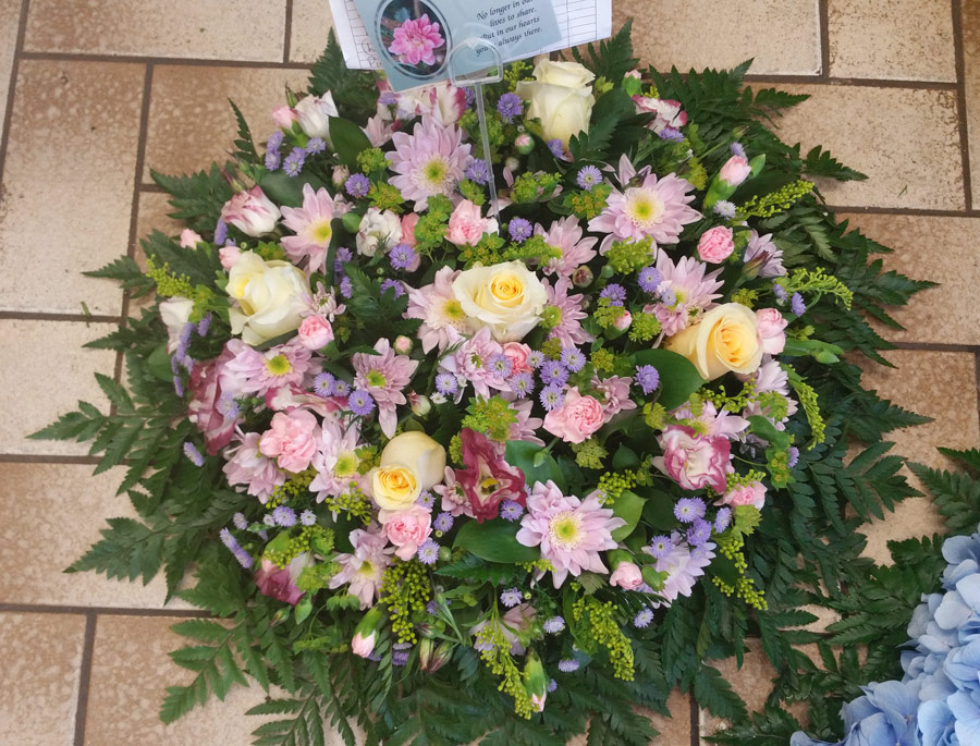 Posy pad - 16 inch loose flower tribute - white rose, pink and purple chrysanthemum spray and lisianthus