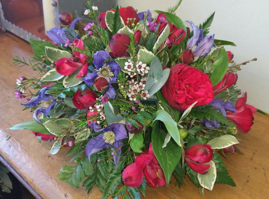 Small posy in a dish - red and purple rose, clematis and alstomeria mix