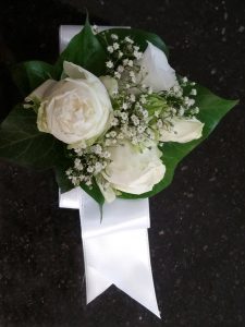 White rose and gypsophila wrist corsage