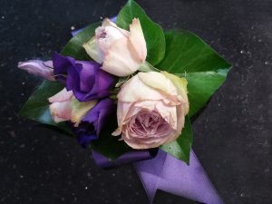 Pink rose and purple lisianthus wrist corsage