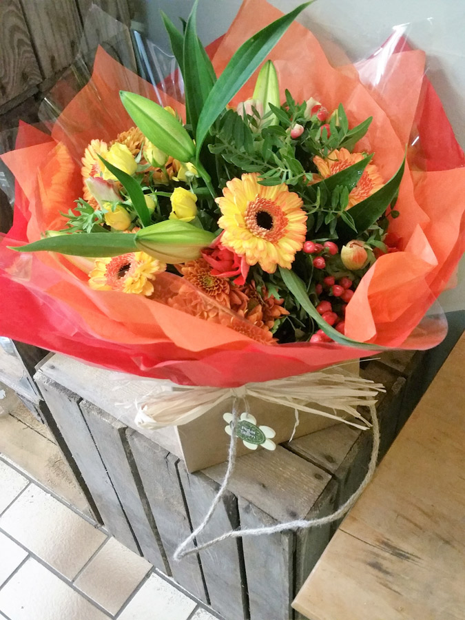 Handtied gift bouquet aqua pack with roses, lily, gerbera and dahlias