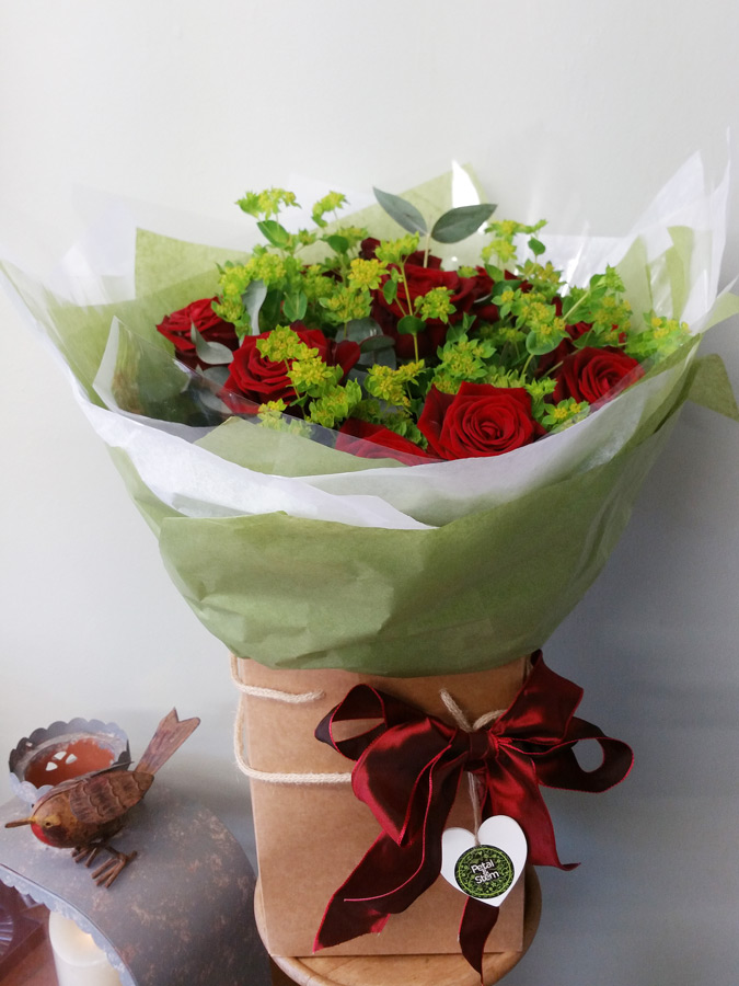 Dozen hand tied red roses gift bouquet