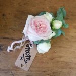 Pink and white rose groom buttonhole