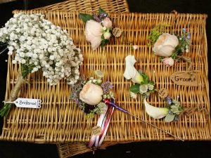 Wedding buttonholes, corsages, bridesmaid bouquet and flowerwand