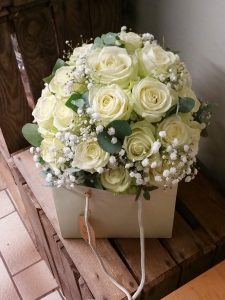 White rose and gypsophila bridal bouquet packed