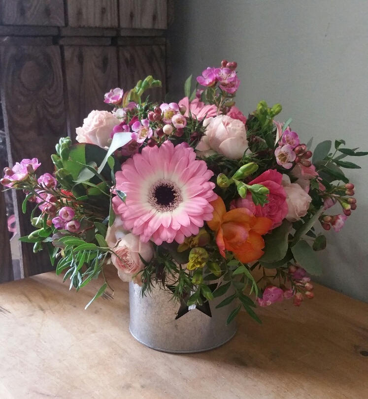 Small Pink Arrangement in a tin container